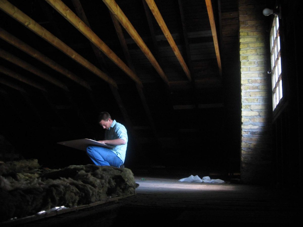 Timothy measures the attic of the coach house above the 1930’s garage of Walter Burley Griffin’s Carter house in 2008. The project won an Evanston Preservation and Design Award.
